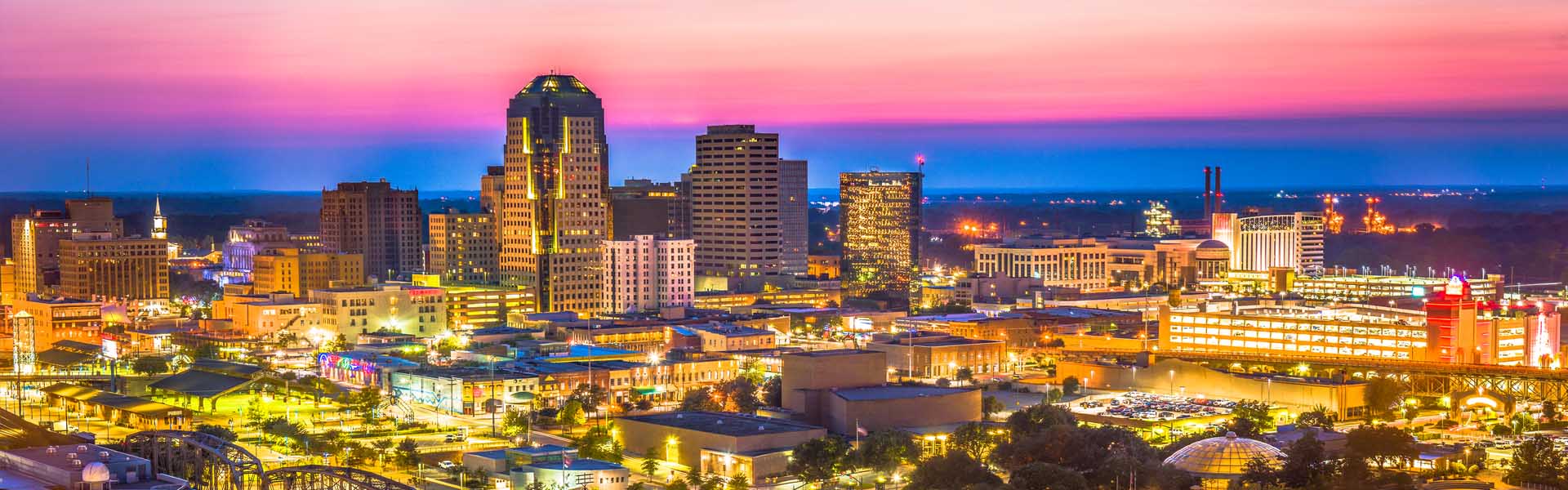 Neon color image of a band playing and people singing along
