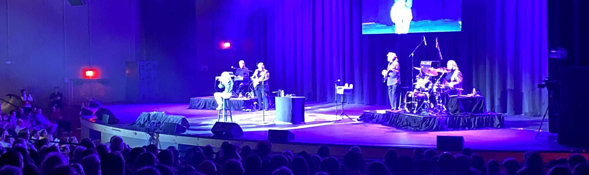 signer on stage in chair washed out by the lights Shreveport
